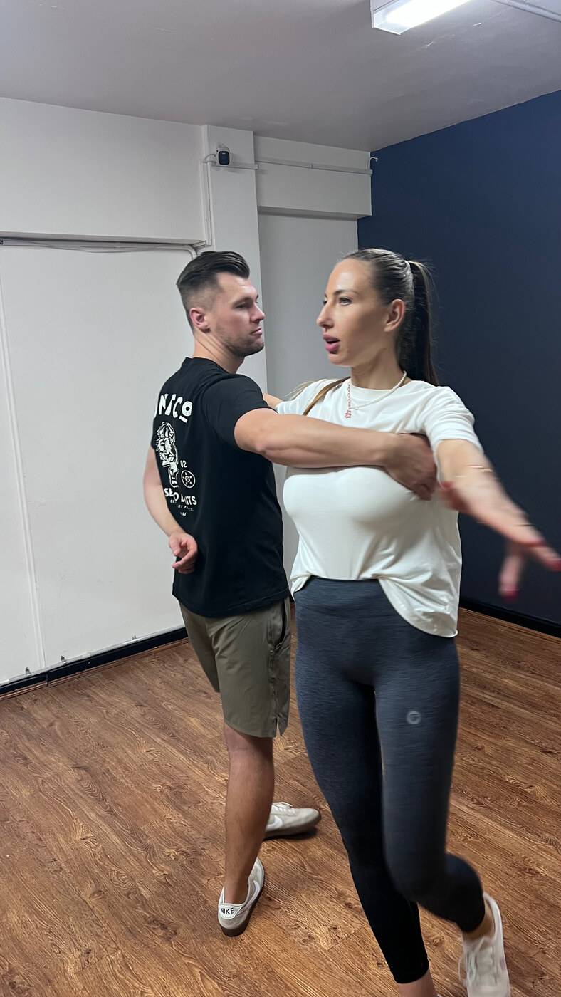 Couple rehearsing a turn